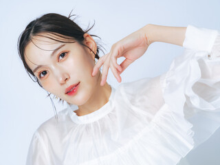 Beauty portrait of attractive Asian woman. Fashion, skin care, cosmetics, make-up, hair removal concept.