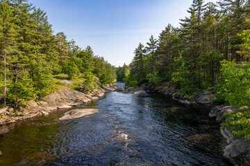 Victoria Falls on Black River in Washago, Ontario offers a serene natural escape with lush forests and pristine waters.