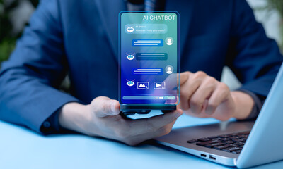 AI Chatbot Customer Service Concept, Businessman using mobile and laptop applications for digital support, automated replies, photos, videos, and online communication