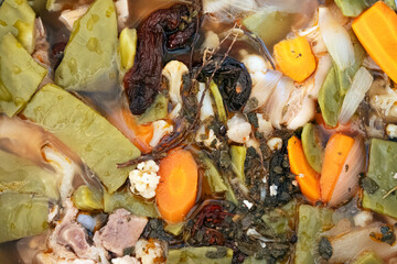 Pickled pig's feet with nopales and vegetables prepared for a traditional Mexican dish