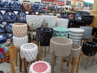 Talavera crafts in Mexico showcase various decorative pottery and planters at a vibrant market
