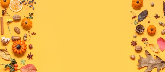 Candles in shape of pumpkins, autumn leaves, nuts and berries on yellow background with space for text