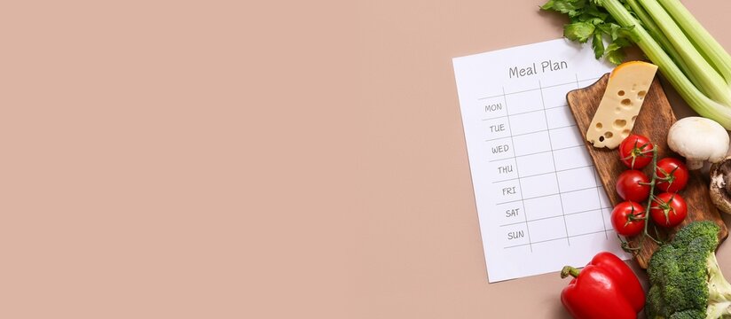 Healthy products and weekly meal plan on brown background with space for text