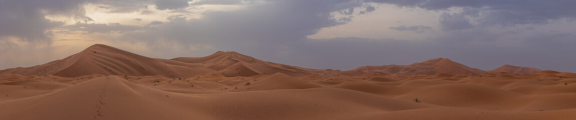 Sunset panoramic landscape views of Erg Chebbi sand dunes located in Morocco on the western edge of the Sahara Desert
