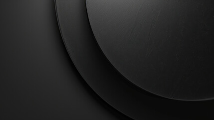 Smooth black surface with layered circular shapes creating modern and minimalist aesthetic. subtle texture adds depth, making it ideal for backgrounds or design elements