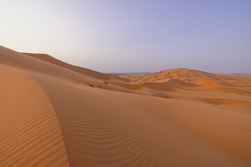 Sunset panoramic landscape views of Erg Chebbi sand dunes located in Morocco on the western edge of the Sahara Desert