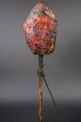 Severed effigy of a human head placed on the end of a wooden stake
