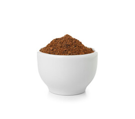 Bowl of aromatic powdered spice on white background