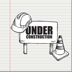 A construction zone is marked with a safety sign, cone, and hard hat