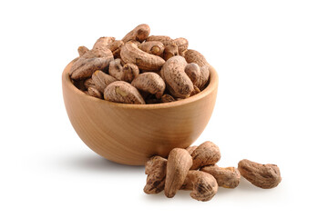 Bowl of cashew nuts with shell isolated on white background.