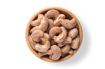 Cashew nuts with shell  in wooden bowl isolated on white background. Top view