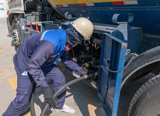 The technician is connecting an additional gas line from truck to supply gas to the bulk tank.