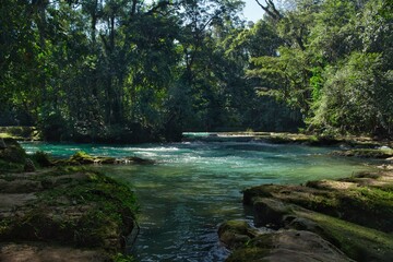 Agua Azul Waterfalls in Chiapas, Mexico &mdash; vibrant turquoise cascades flowing through lush jungle, a natural wonder of southern Mexico.