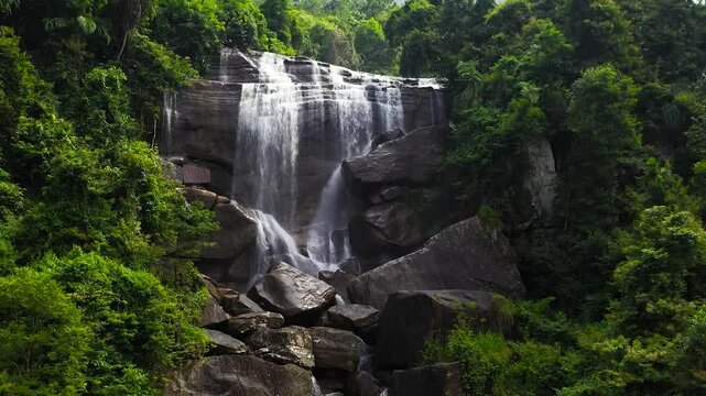 Waterfall in the green forest. Olu Ella Falls in the jungle. Sri Lanka.