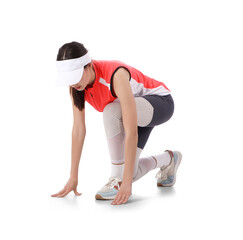 Beautiful young sporty woman getting ready to run on white background