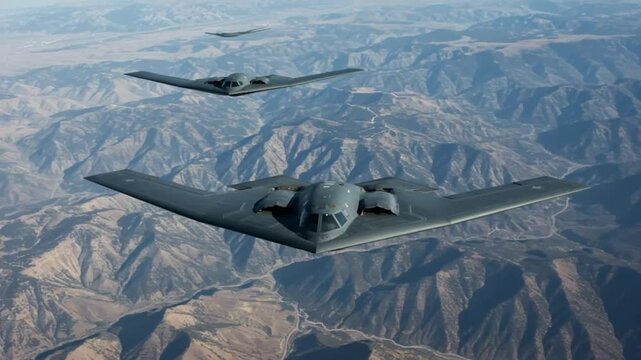 Stealth Bombers in Flight Over Mountainous Terrain: A Stunning Aerial View of Military Aviation