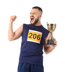 Happy young man with gold cup after running marathon on white background
