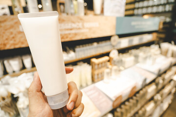 Blank plastic tube mockup for cosmetics with cap. Lotion skin care empty package bottle template container. Skincare cosmetic gel tube. A tube of face or hand cream. Copy space.