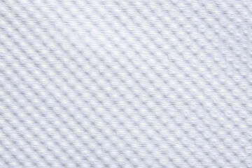  close-up of a white woven fabric, showcasing its delicate, uniform texture and subtle shadows.