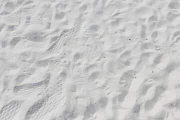 Fine white sand that glistens and reflects the sunlight.