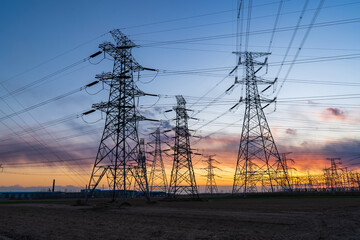 The pylons are in the evening, Substation in the evening, High voltage substation and beautiful sunset glow