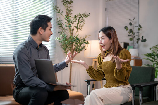 A man and a woman are sitting on a couch