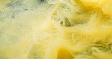 Color vapor. Ink shot. Yellow curl pigment underwater dissolve. Haze liquid bright spray on wet background abstract defocused flow.