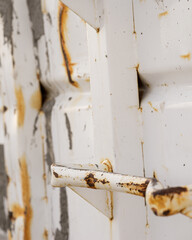 rusty metal handle of a construction dumpster