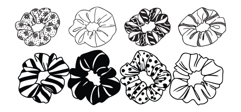A collection of eight different black and white decorative scrunchies illustrating diverse patterns for hairstyling