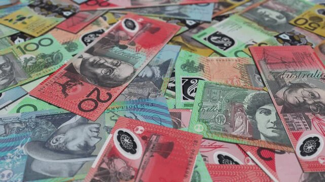 A large pile of scattered australian dollar bills, HD footage.