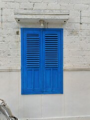 blue window with shutters like in italy