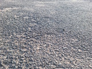 This is a close-up of an asphalt road.