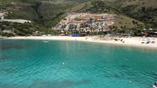 panoramic of Jale Beach in Himara, Albanian riviera. Resorts construction in background