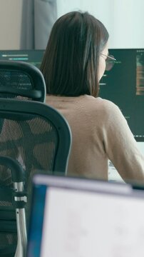 Vertical Screen : Young adult Asia female freelance eyeglasses typing write prompt AI bot app smart program nomad, video game, terminal coding, user interface, designer, big data center on computer.