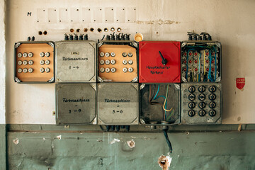 Abandoned industrial hall with old furniture, metal parts, and dusty workspaces. Atmospheric lost...