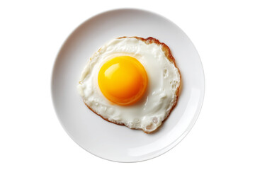 Sunny-side up fried egg with crisp edges on white plate from above on white transparent background, breakfast simplicity