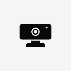 Simple black and white webcam icon with geometric shapes and clean design. Features circular lens and stand. Perfect for tech, streaming, or UI/UX projects.