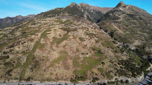 Mount Burke And Lake Hawea At Daytime In South Island, New Zealand - Aerial Pullback