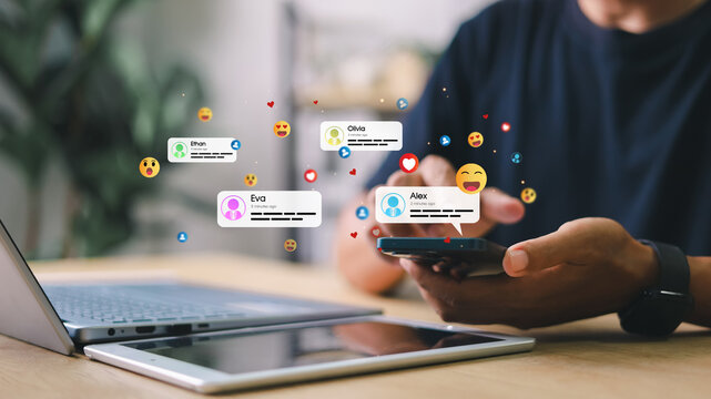 Man using smartphone with floating social media message notifications and emoji reactions. Concept of digital communication, social engagement, and real-time interaction.