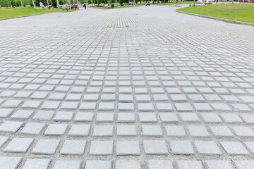 Fototapeta premium Grey paving stones arranged in a grid pattern.