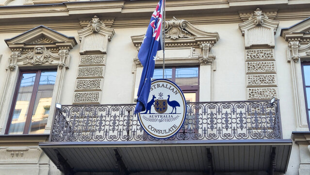 Vilnius Lithuania - 06.14.2025 Australian consulate emblem and flag on a decorative balcony of a historic European building with ornate architectural details