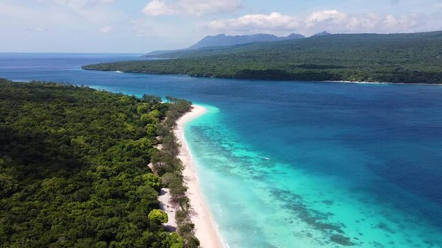 Aerial view of Jaco Island and mainland of Timor-Leste divided by ocean strait in Southeast Asia