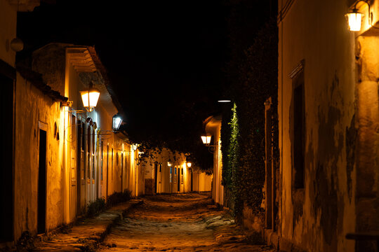 Warm Street Lighting on a Quiet Night in Paraty, Brazil - Powered by Adobe