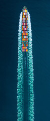 Cargo Container Ship sailing through deep blue ocean waters, leaving a vibrant symmetrical wake behind. Express Container ship running very fast.