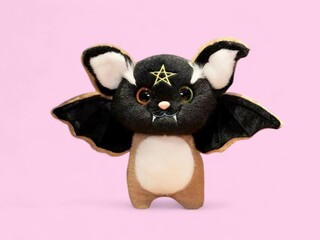 Dangerous bats animal soft toy isolated on the pink background