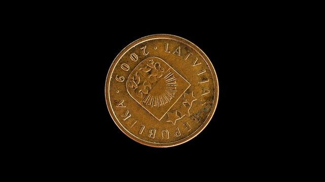 Latvia 2009 2 santimi coin obverse displaying small coat of arms rotating on black background