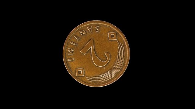 Latvia 2009 2 santimi coin reverse showing denomination with five arcs and two diamond‑shaped suns rotating on black background