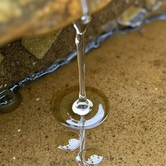 Water dripping slowly onto stone, echoing louder than footsteps.