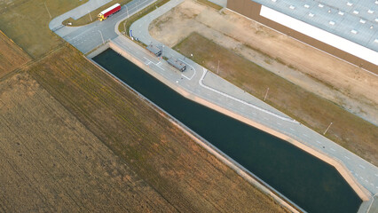 Industrial complex with water reservoir used for heating and cooling