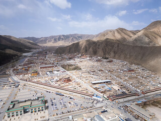 Xiahe, China: Aerial view of the Tibetan Buddhism Labrang Monastery surrounded by a 3km long prayer wheel circuit  in the Xiahe town in the Amdo region of Gansu province on the Tibetan plateau